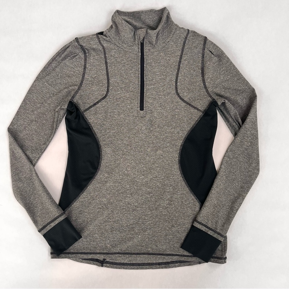 Champion women’s grey and Black 1/2 Zip-Up leisure wear top.